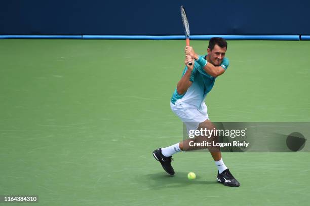 Bernard Tomic of Australia returns a backhand to Alex De Minaur of Australia during the BB&T Atlanta Open at Atlantic Station on July 26, 2019 in...