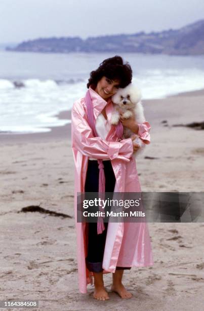 America actress Joyce DeWitt poses for a portrait with her dog at the beach circa 1980 in Los Angeles, California.