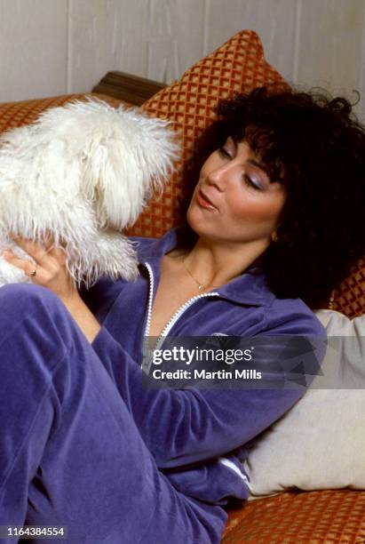 America actress Joyce DeWitt poses for a portrait with her dog at her home circa 1980 in Los Angeles, California.