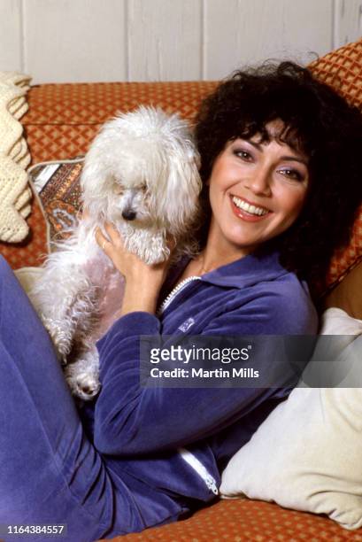 America actress Joyce DeWitt poses for a portrait with her dog at her home circa 1980 in Los Angeles, California.