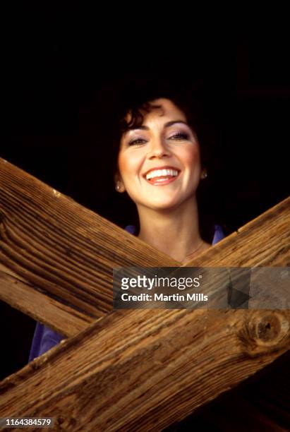 America actress Joyce DeWitt poses for a portrait at the beach under the pier circa 1980 in Los Angeles, California.