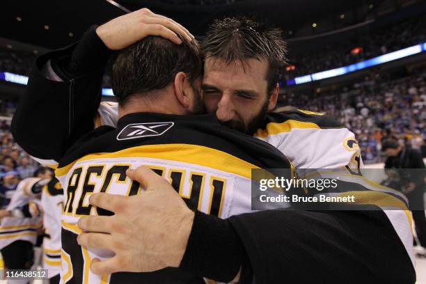 Mark Recchi of the Boston Bruins hugs Patrice Bergeron after defeating the Vancouver Canucks in Game Seven of the 2011 NHL Stanley Cup Final at...