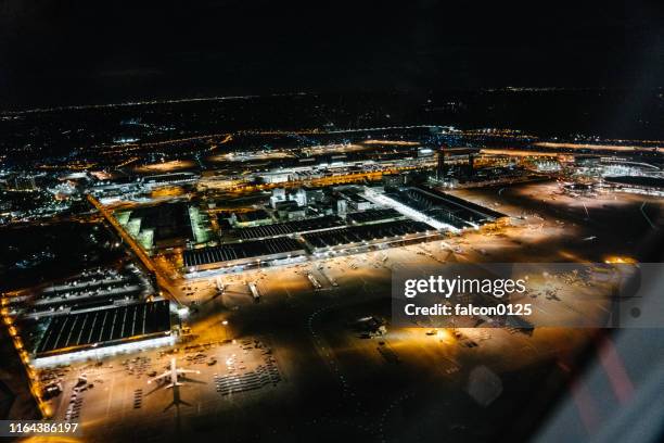 the aerial view of narita international airport at night from the airplane - narita city stock pictures, royalty-free photos & images