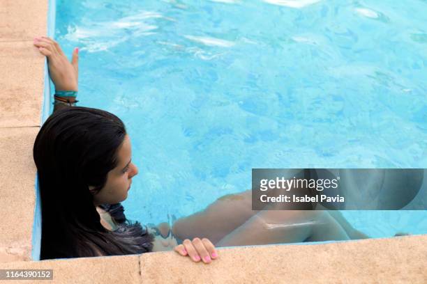 woman relaxed at pool - laguna beach maldives stock pictures, royalty-free photos & images