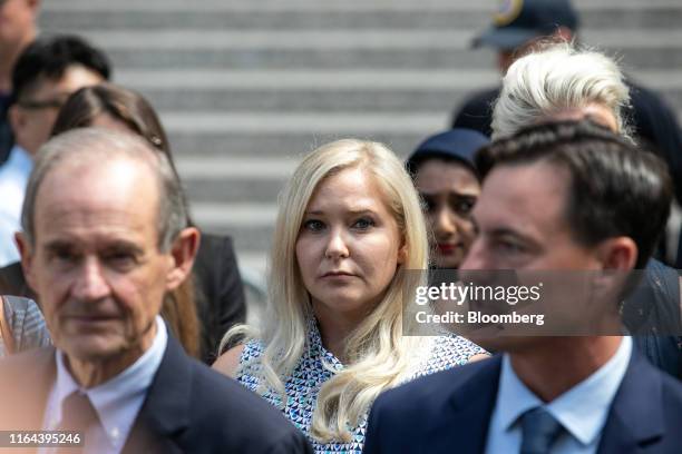 Virginia Giuffre, an alleged victim of Jeffrey Epstein, center, exits from federal court in New York, U.S., on Tuesday, Aug. 27, 2019. Epstein, a...