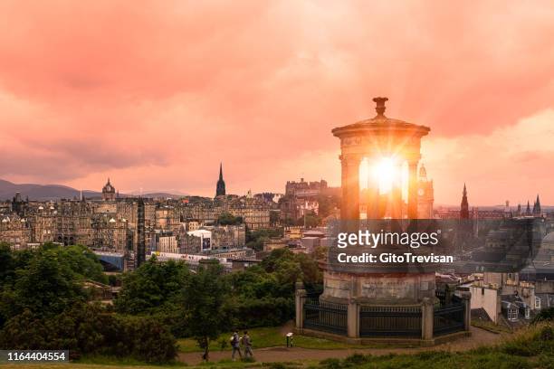 edinburgh's historic skyline at dusk - calton hill viewpoint at sunset - edinburgh castle people stock pictures, royalty-free photos & images