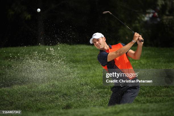 Martin Kaymer of Germany chips from the bunker onto the first green during the second round of the Barracuda Championship at Montreux Country Club on...