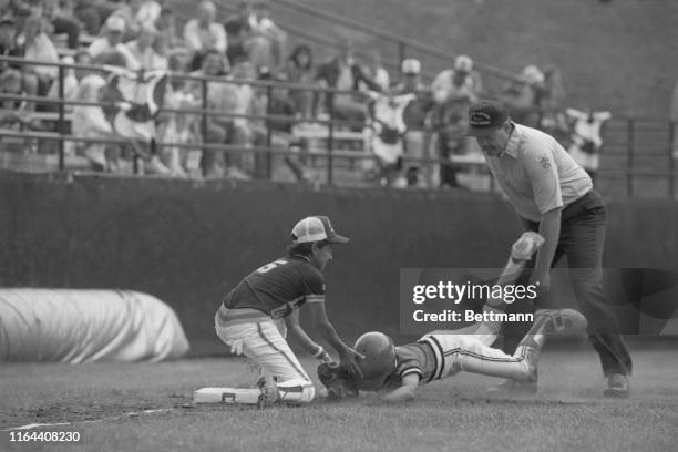 Chen Hsin-Cheng of Taiwan is out on a nose slide to third during second inning of the first game of the 42nd annual Little League Baseball World...