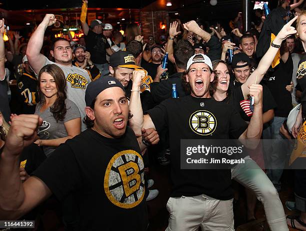 Fans of the Boston Bruins react to a goal at Hurricane O'Reilly's Bar during Game Seven of the 2011 Stanley Cup Final against the Vancouver Canucks...