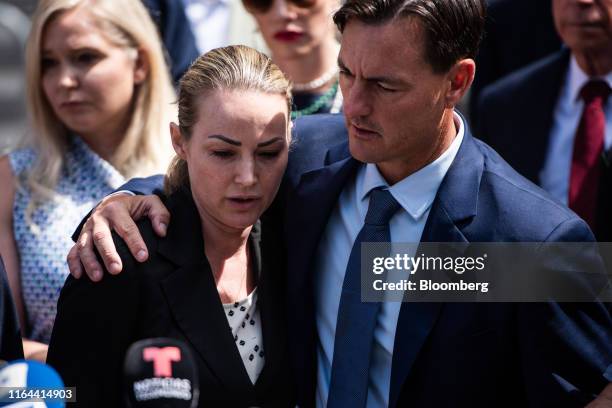 Chauntae Davies, an alleged victim of Jeffrey Epstein, left, speaks to members of the media outside of federal court in New York, U.S., on Tuesday,...