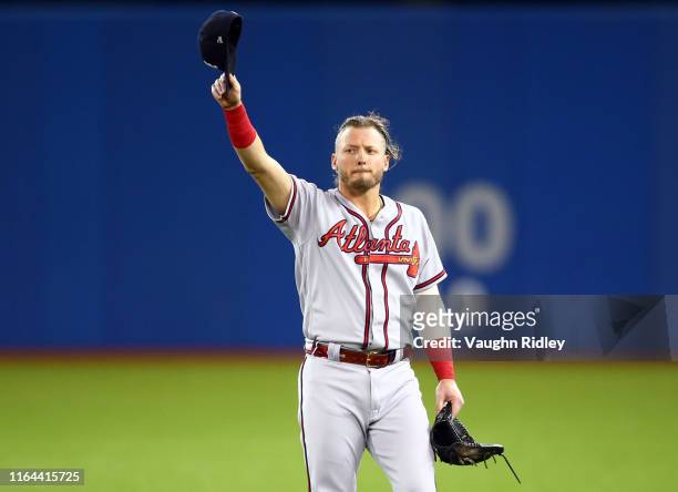 Josh Donaldson of the Atlanta Braves acknowledges applause from the crowd after a video tribute on the big screen prior to the first inning of an MLB...