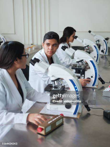 64 Scientist Looking Down Microscope Stock Photos, High-Res Pictures ...