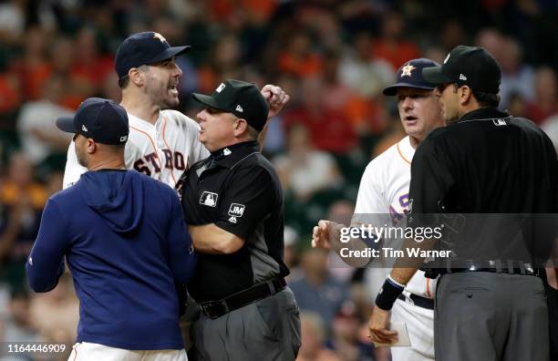 Justin Verlander of the Houston Astros reacts after being ejected in the sixth inning against the Tampa Bay Rays at Minute Maid Park on August 27,...