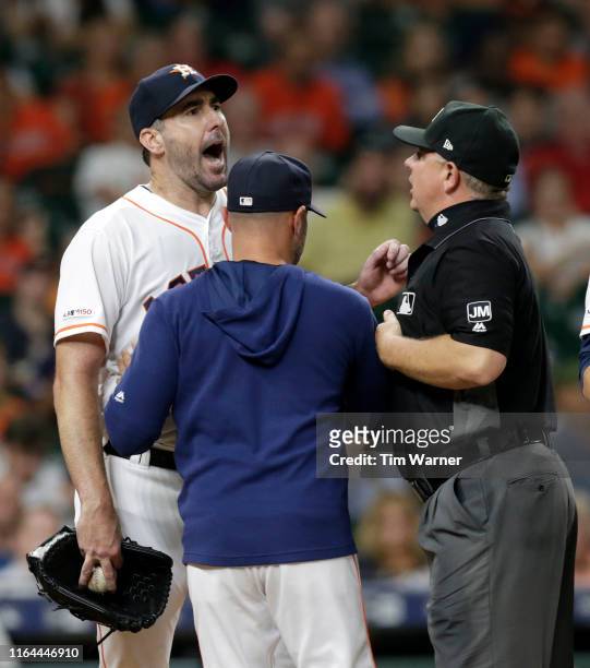 Justin Verlander of the Houston Astros reacts after being ejected in the sixth inning against the Tampa Bay Rays at Minute Maid Park on August 27,...