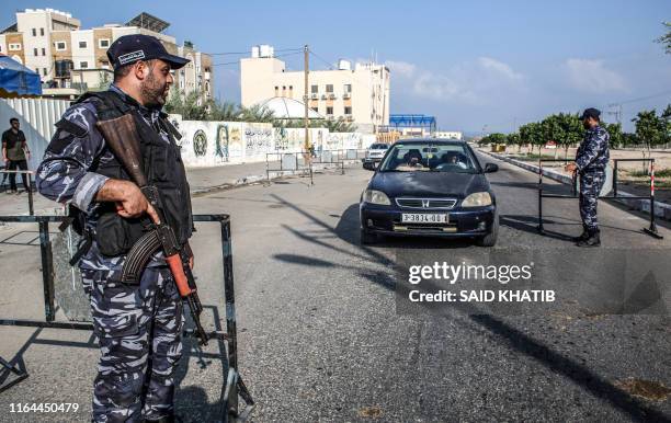 Security forces loyal to Palestinian Islamist movement Hamas stop a vehicle at a checkpoint in Khan Yunis in the southern Gaza Strip on August 28,...