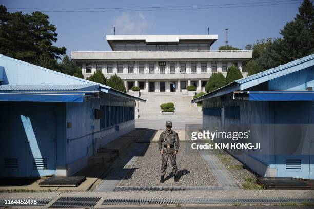 South Korean soldier stands guard at the truce village of Panmunjom inside the Demilitarized Zone separating the two Koreas on August 28, 2019.