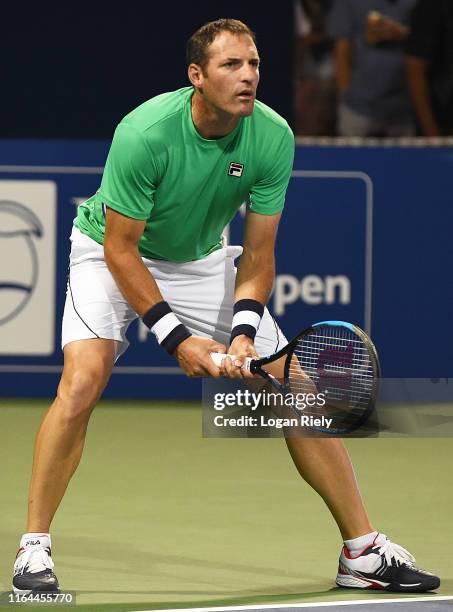 Jonathan Erlich of Israel waits to return a serve from Bob Bryan and Mike Bryan during the BB&T Atlanta Open at Atlantic Station on July 26, 2019 in...