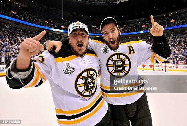 Brad Marchand and Patrice Bergeron of the Boston Bruins celebrate winning the Stanley Cup after defeating the Vancouver Canucks 4-0 in Game Seven of...