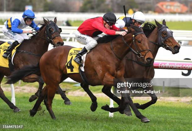 Damien Oliver riding Benitoite defeats Mark Zahra riding Taksu in Race 6 during Melbourne Racing at Caulfield Racecourse on July 27, 2019 in...