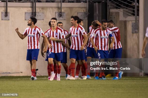 Diego Costa of Atletico Madrid leads his team in a victory march after scoring one of his four goals on the night during the International Champions...