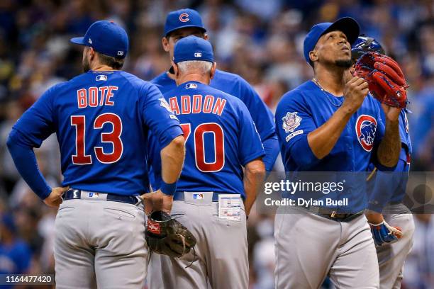 Manager Joe Maddon of the Chicago Cubs relieves Pedro Strop in the eighth inning against the Milwaukee Brewers at Miller Park on July 26, 2019 in...