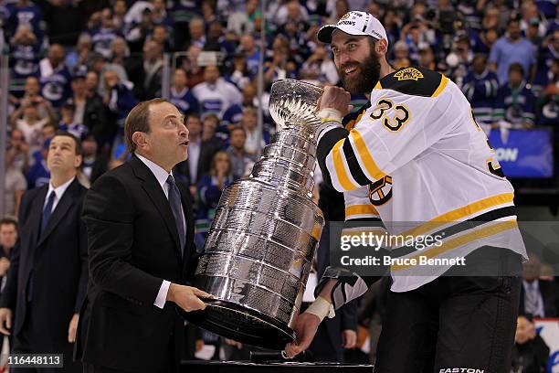 Commissioner Gary Bettman presents the Stanley cup to Zdeno Chara of the Boston Bruins after defeating the Vancouver Canucks in Game Seven of the...