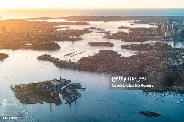 aerial of sydney harbour at sunrise - porto di sydney foto e immagini stock