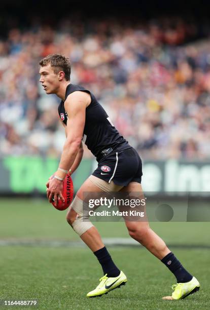 Patrick Cripps of the Blues kicks during the round 19 AFL match between the Carlton Blues and the Adelaide Crows at Melbourne Cricket Ground on July...