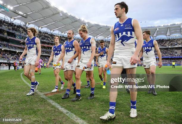 The Kangaroos leave the field after the teams defeat during the round 19 AFL match between the West Coast Eagles and the North Melbourne Kangaroos at...