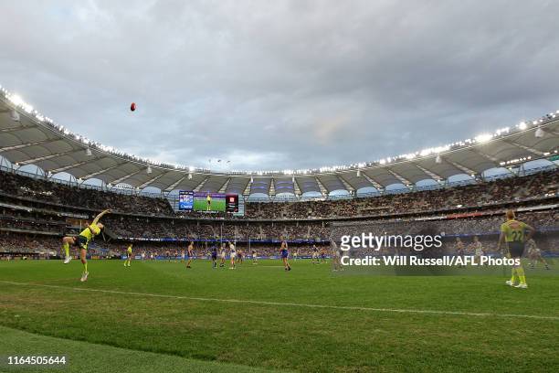 The boundary umpire throws the ball into play during the round 19 AFL match between the West Coast Eagles and the North Melbourne Kangaroos at Optus...