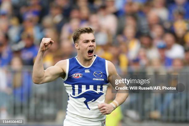 Cameron Zurhaar of the Kangaroos celebrates after scoring a goal during the round 19 AFL match between the West Coast Eagles and the North Melbourne...