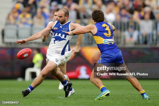 Ben Cunnington of the Kangaroos kicks the ball during the round 19 AFL match between the West Coast Eagles and the North Melbourne Kangaroos at Optus...