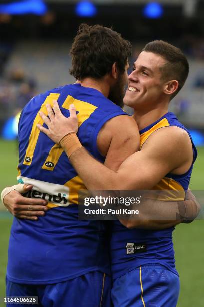 Jake Waterman of the Eagles embraces Josh Kennedy after winning the round 19 AFL match between the West Coast Eagles and the North Melbourne...