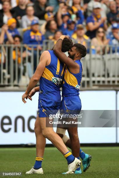 Liam Ryan of the Eagles congratulates Josh Kennedy after kicking his 600th goal during the round 19 AFL match between the West Coast Eagles and the...
