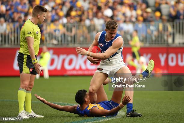 Cameron Zurhaar of the Kangaroos pushes Hamish Francis Watson of the Eagles away after being awarded a free kick during the round 19 AFL match...