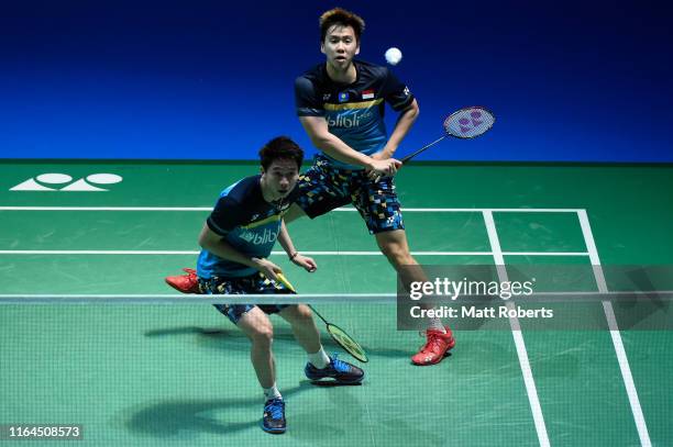 Marcus Fernaldi Gideon and Kevin Sanjaya Sukamuljo of Indonesia compete in the Men's Doubles semifinal match against Li Jun Hui and Liu Yu Chen of...