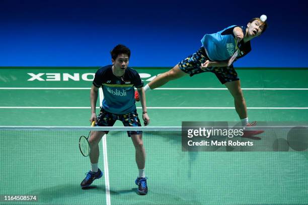 Marcus Fernaldi Gideon and Kevin Sanjaya Sukamuljo of Indonesia compete in the Men's Doubles semifinal match against Li Jun Hui and Liu Yu Chen of...