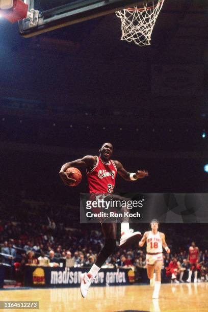 Michael Jordan of the Chicago Bulls dunks the ball against the New York Knicks on November 8, 1984 at the Madison Square Garden, New York, New York....