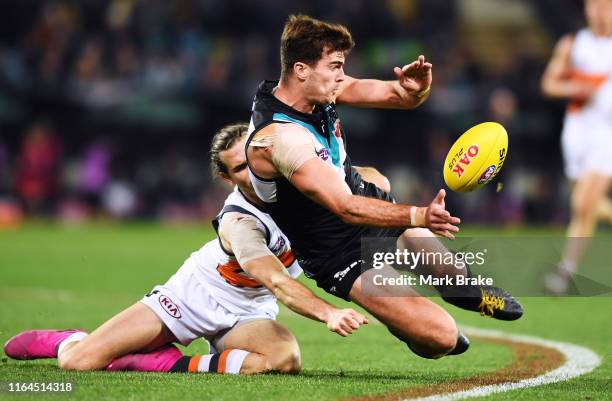 Scott Lycett of Port Adelaide competes with Phil Davis of the Giants during the round 19 AFL match between the Port Adelaide Power and the Greater...