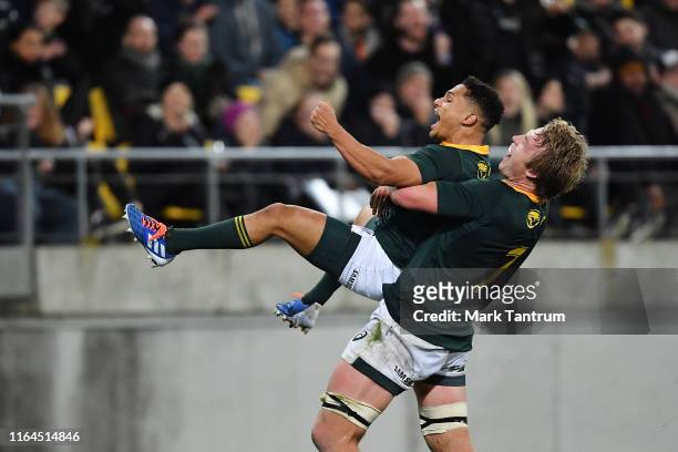 Pieter-Steph du Toit of the Springboks and Herschel Jantjies of the Springboks celebrate during the 2019 Rugby Championship Test Match between New...