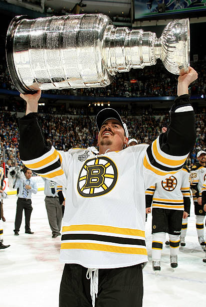 tomas-kaberle-of-the-boston-bruins-hoists-the-stanley-cup-after-defeating-the-vancouver.jpg