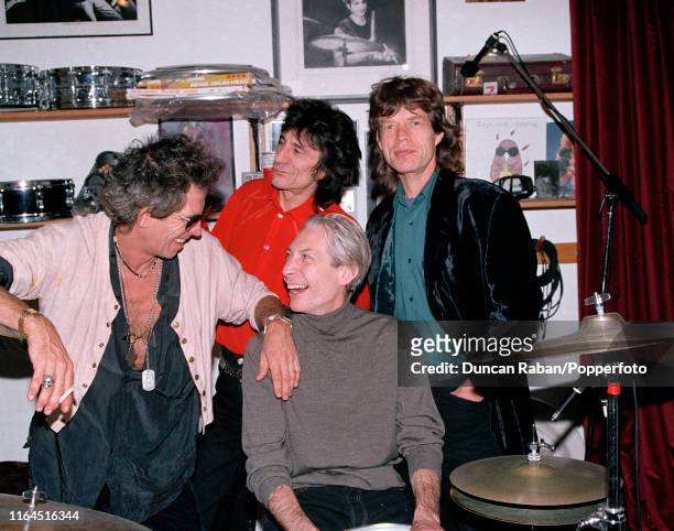 The Rolling Stones Keith Richards, Ronnie Wood, Charlie Watts and Mick Jagger posing in the snooker room of Ronnie Wood's home near Dublin in County...