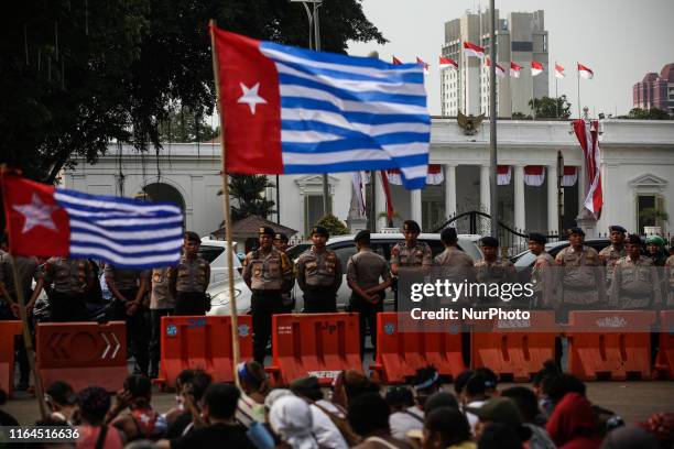 The West Papua flag, the Morning Star and The flag of Indonesian is seen during a rally in Jakarta, Indonesia, on August 28, 2019. Student and...