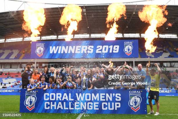 Players of Leeds Rhinos celebrate with the trophy after the Coral Women's Challenge Cup Final between Castleford Tigers and Leeds Rhinos at...