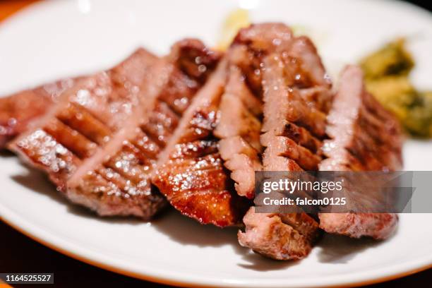 grilled beef tongue in japan - miyagi prefecture stock pictures, royalty-free photos & images