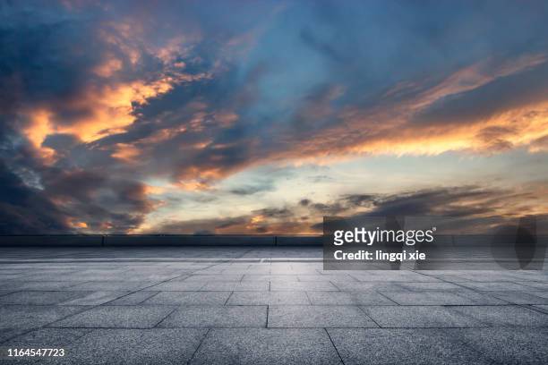viewing the gorgeous sunset from the platform - dusk stock pictures, royalty-free photos & images