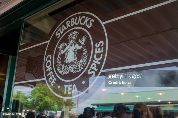 The Starbucks sign is seen on the window of the World's first ever Starbucks coffee shop which opened in Pike Place in Seattle in 1971.