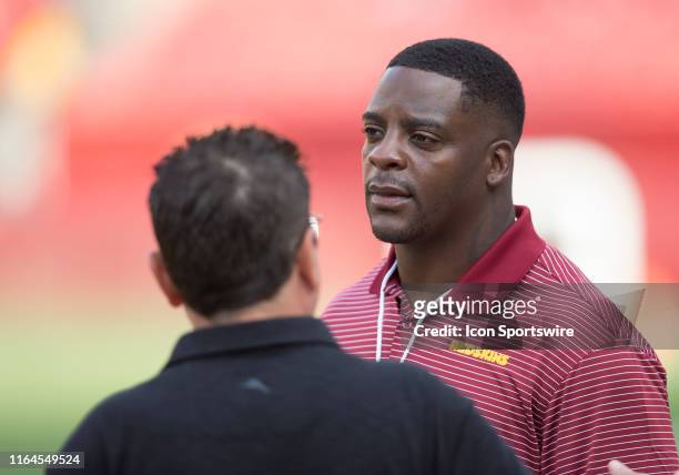 Former Washington Redskins running back Clinton Portis looks on from the sidelines prior to the NFL preseason game between the Cincinnati Bengals and...
