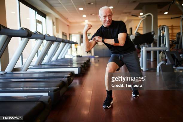 lifestyle  gym and fitness barcelona. mature man playing around and joking. - clown stock pictures, royalty-free photos & images