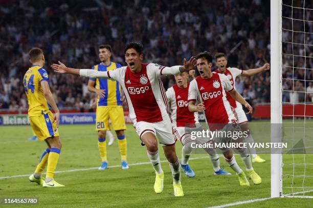 Ajax Amsterdam's Mexican forward Edson Alvarez celebrates after scoring during the UEFA Champions League Group phase football match between Ajax...